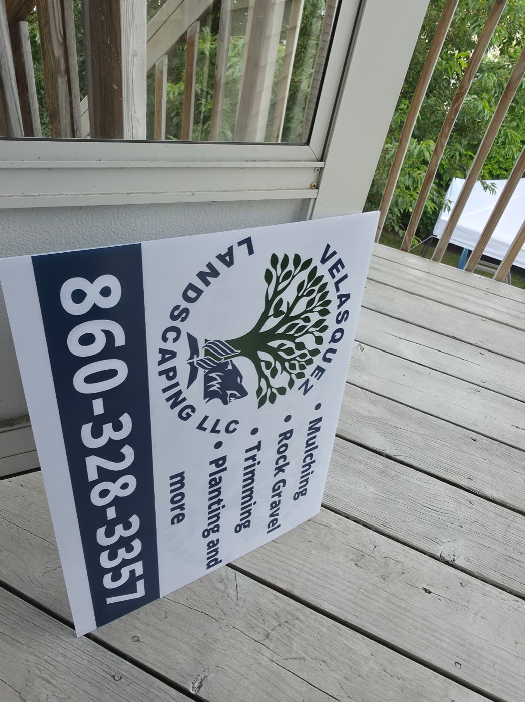 Velasquez Landscaping yard sign with phone number